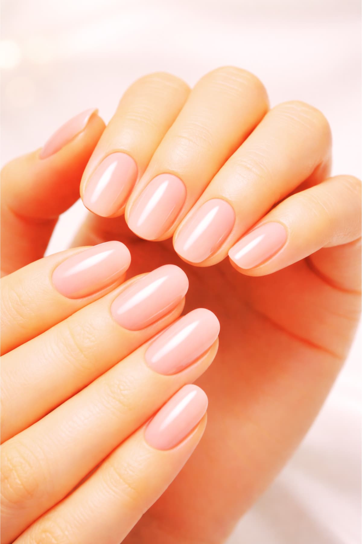 Milky pink jelly gel nail polish manicure with sheer nude translucent finish and glossy shine