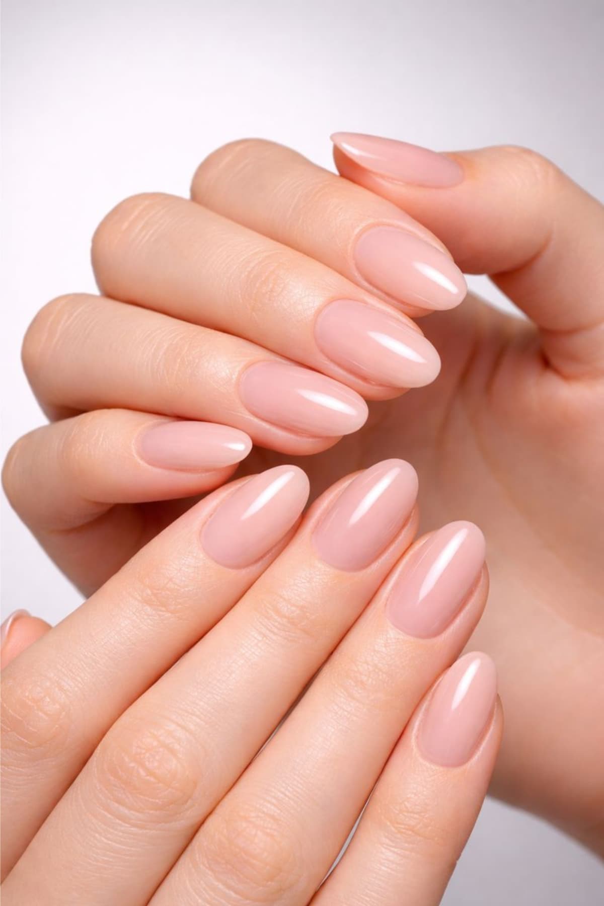 Clean natural manicure with nail concealer finish and glossy top coat in milky neutral tones