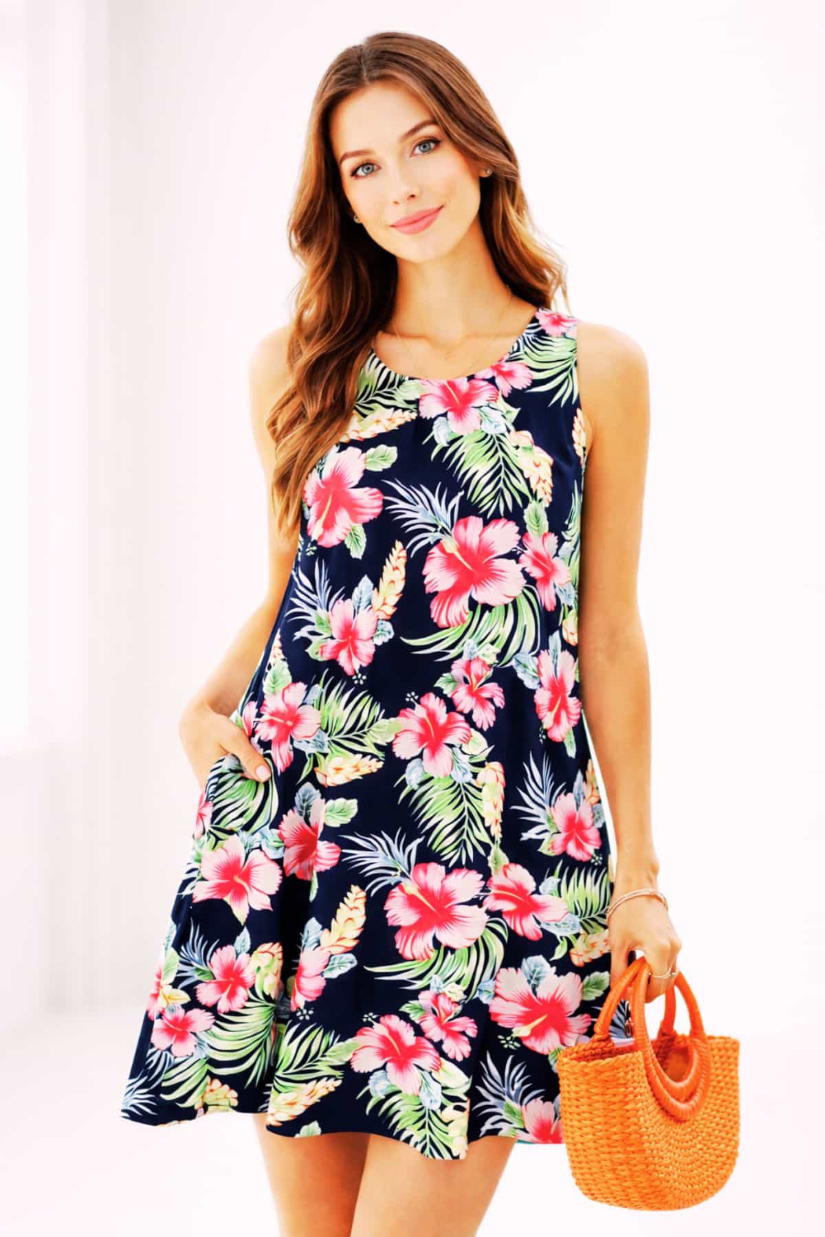Navy tropical floral women’s summer dress with pockets — worn by a beautiful 23-year-old woman with very fair natural skin, bright blue eyes, brown silky hair, fit toned body, peaceful confident expression, sleeveless casual sundress for everyday comfort