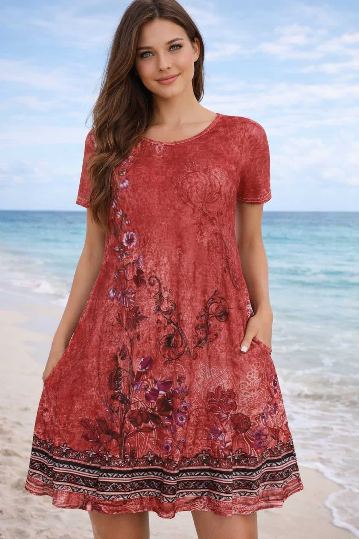 Best women’s summer dresses include this beach vacation summer dress — lightweight breathable fabric with a flowy relaxed fit for warm weather, worn by a beautiful 23-year-old woman with very fair natural skin, bright blue eyes, brown silky hair, fit toned physique, peaceful confident expression in a bright summer outdoor setting