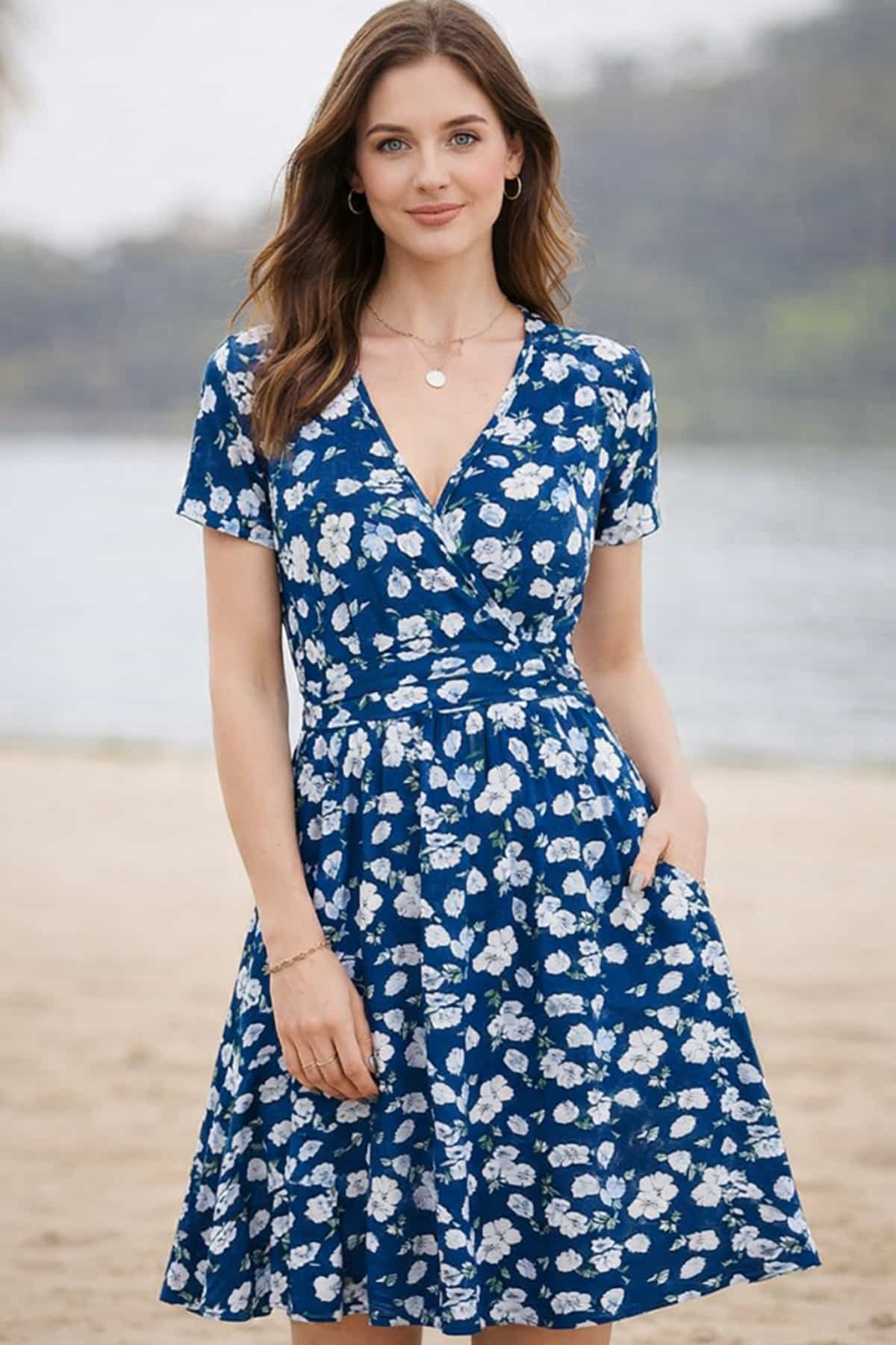 Women’s floral summer dress with pockets — a beautiful 23-year-old woman with very fair natural skin, bright blue eyes, brown silky hair, fit toned body, peaceful relaxed confident expression, wearing a vibrant floral midi dress in a bright summer outdoor setting